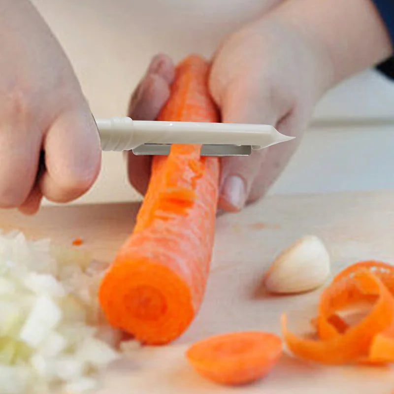 Person peeling a carrot with a vegetable peeler on a cutting board.