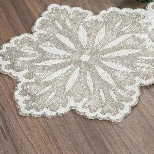 Close-up of beaded linen table runner showing intricate detail